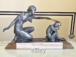 Grande sculpture Art Déco signée P. Sega, onyx marbre régule, Femme et Faune
